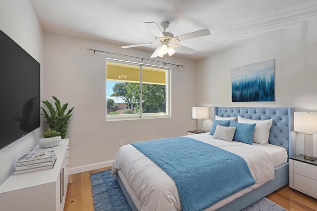 98202 Windward Ave, Key Largo, FL 33037 - bedroom with light wood-style flooring, a ceiling fan, and baseboards