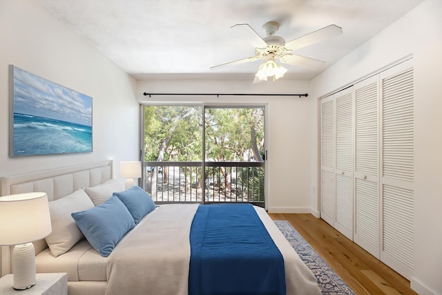98202 Windward Ave, Key Largo, FL 33037 - bedroom featuring access to exterior, wood finished floors, ceiling fan, a closet, and baseboards