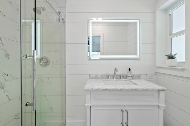 bathroom with vanity and walk in shower