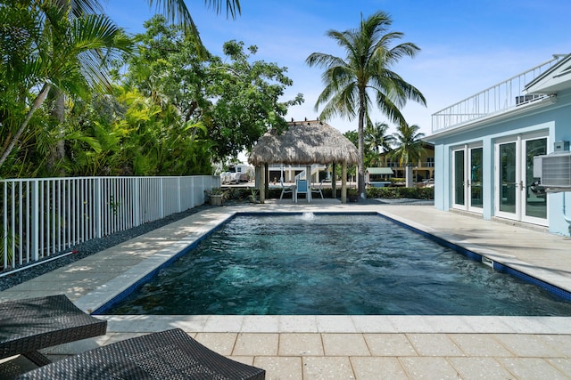 view of pool featuring a gazebo, a patio area, and central air condition unit