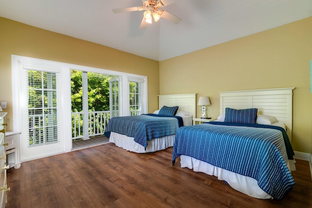 bedroom featuring multiple windows, dark hardwood / wood-style flooring, lofted ceiling, and ceiling fan