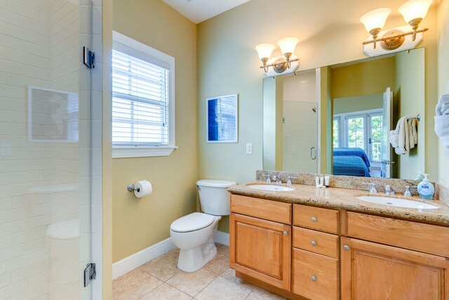 bathroom with toilet, plenty of natural light, a shower with door, and tile patterned flooring