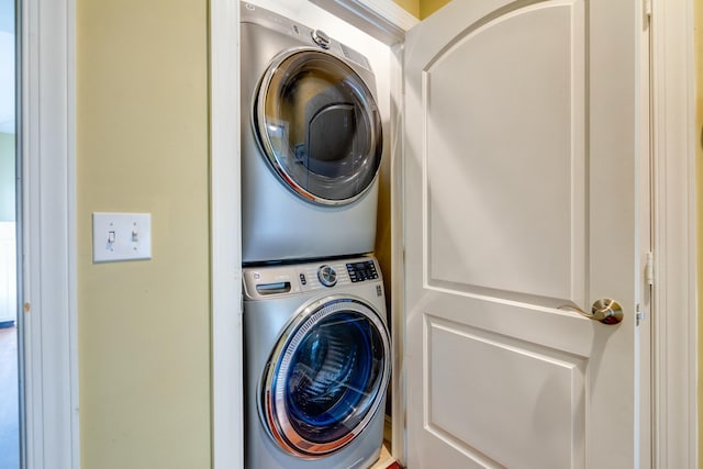 washroom with stacked washer / dryer