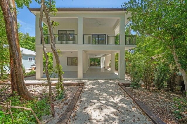 793 Oceana Ave, Key Largo, FL 33037 - view of front of home with stucco siding and a balcony