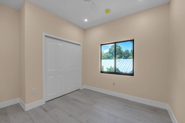 793 Oceana Ave, Key Largo, FL 33037 - unfurnished bedroom with light wood-style floors, recessed lighting, and a closet