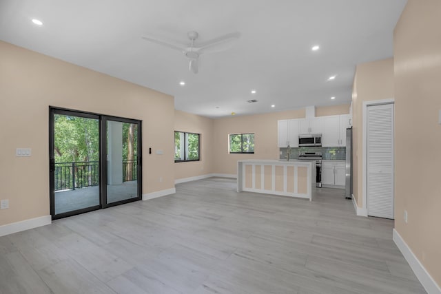 793 Oceana Ave, Key Largo, FL 33037 - unfurnished living room featuring a ceiling fan, light wood-style flooring, and recessed lighting