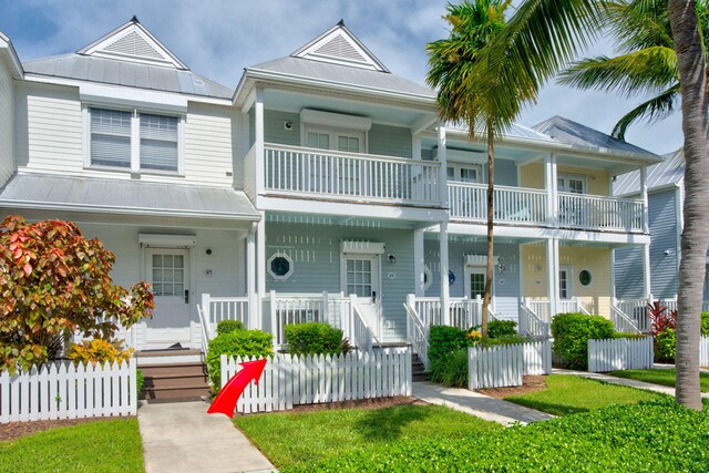 view of front of property with a balcony