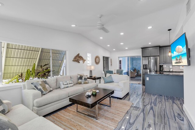 1519 Johnson St, Key West, FL 33040 - living room featuring ceiling fan, lofted ceiling, and light hardwood / wood-style flooring