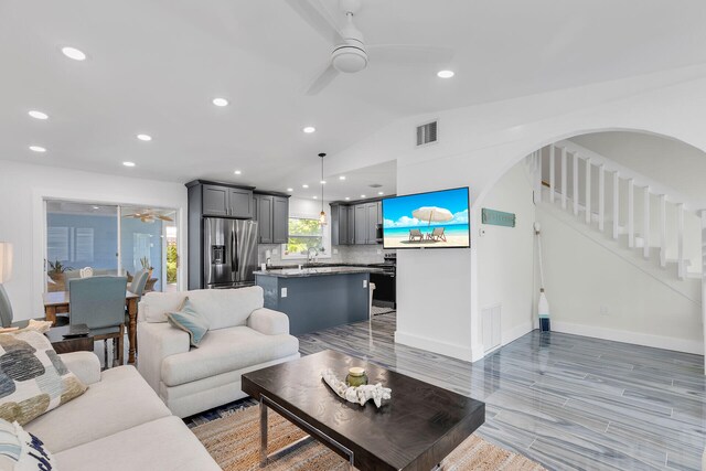1519 Johnson St, Key West, FL 33040 - living room with lofted ceiling, sink, ceiling fan, and light wood-type flooring