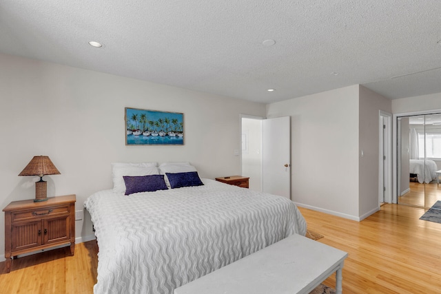 1519 Johnson St, Key West, FL 33040 - bedroom featuring hardwood / wood-style floors and a textured ceiling