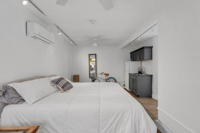 1519 Johnson St, Key West, FL 33040 - bedroom featuring sink, a wall mounted air conditioner, white refrigerator, dark hardwood / wood-style floors, and ceiling fan