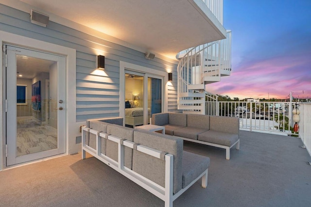 patio terrace at dusk with an outdoor hangout area and stairway