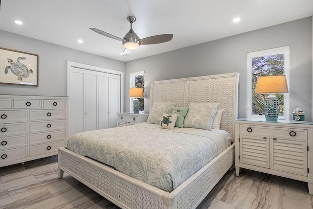 bedroom featuring multiple windows, a closet, recessed lighting, and a ceiling fan