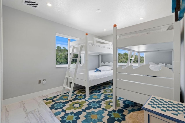 bedroom with baseboards and recessed lighting