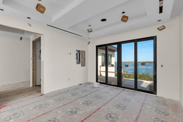 25 Mutiny Pl, Key Largo, FL 33037 - empty room with a tray ceiling, a water view, and french doors
