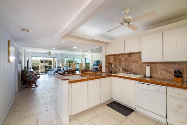 kitchen featuring white cabinetry, dishwasher, backsplash, light tile patterned floors, and kitchen peninsula