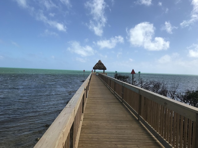 view of dock featuring a water view and a gazebo