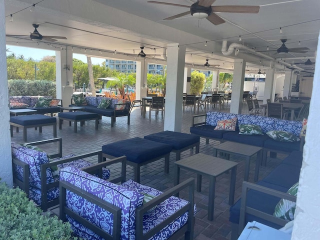 view of patio / terrace with ceiling fan and an outdoor living space