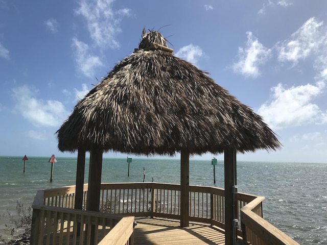 dock area with a gazebo and a water view