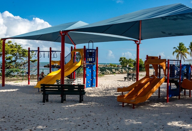 view of jungle gym with a water view