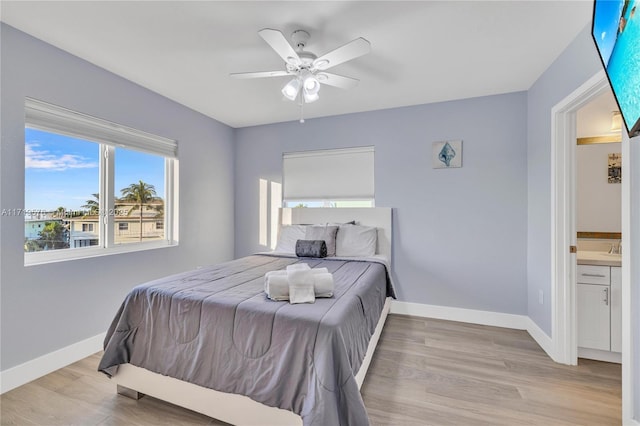 bedroom with ceiling fan and light wood-type flooring