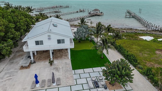 birds eye view of property with a water view