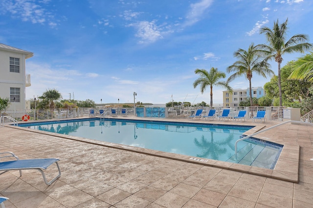 view of swimming pool with a patio