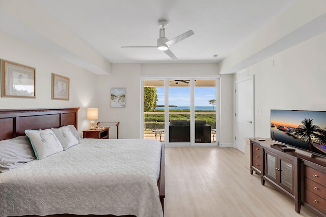 bedroom featuring ceiling fan, light hardwood / wood-style flooring, and access to outside