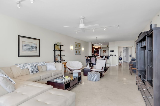 living room with rail lighting and ceiling fan