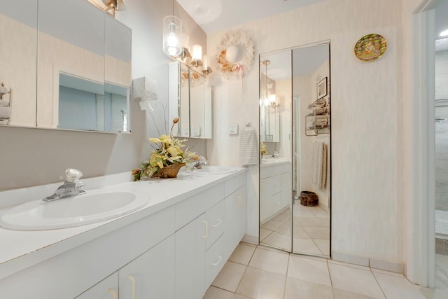 bathroom with vanity and tile patterned flooring