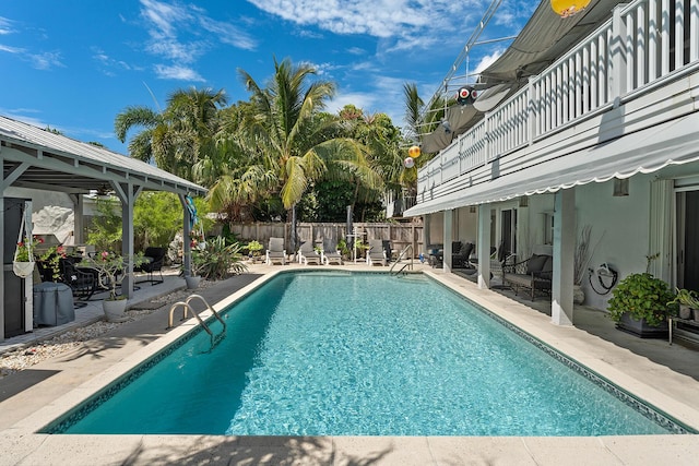 view of swimming pool with a patio area