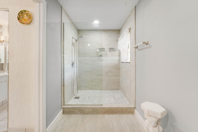 bathroom with tiled shower