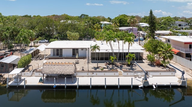 rear view of property with a water view