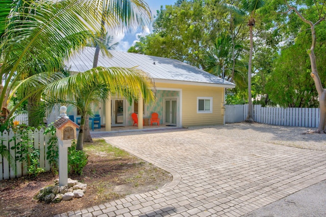 view of front of property featuring fence and a gate