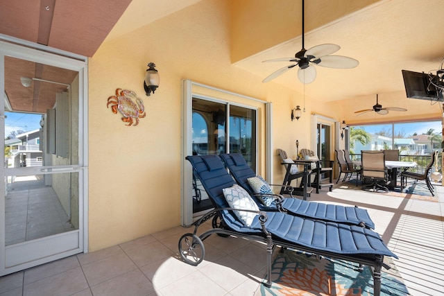 view of patio / terrace with outdoor dining area and ceiling fan