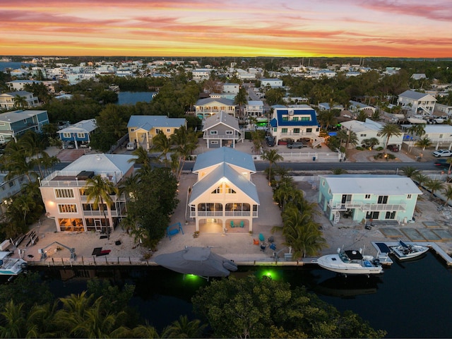 aerial view with a water view and a residential view