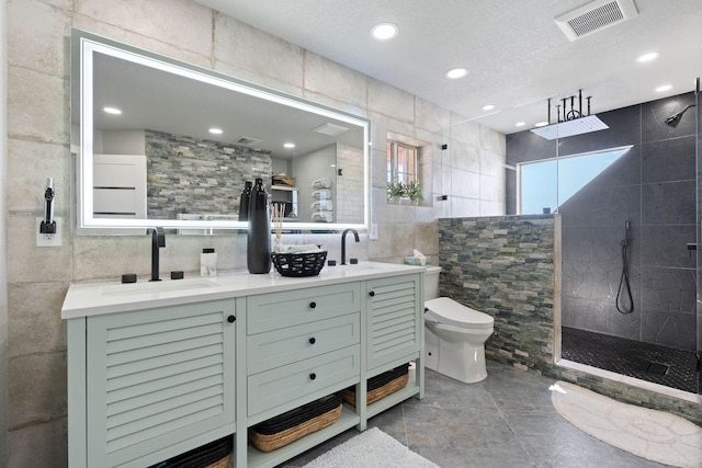 full bath with visible vents, toilet, tile walls, walk in shower, and a sink