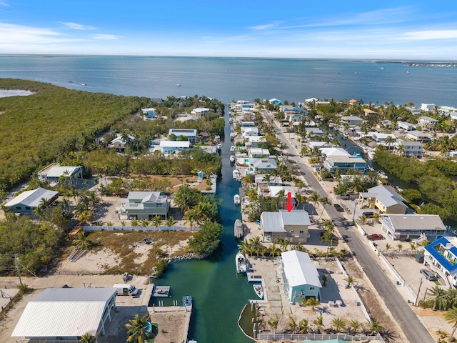 bird's eye view featuring a water view and a residential view