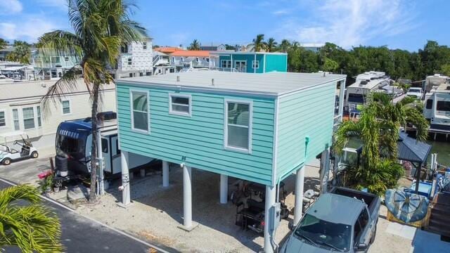 rear view of house with a carport