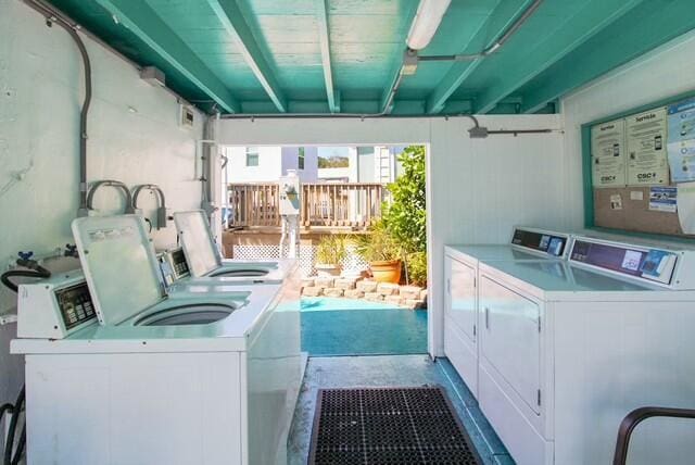 community laundry room featuring washer and dryer