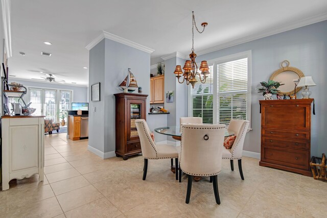 tiled dining area with ornamental molding and ceiling fan with notable chandelier