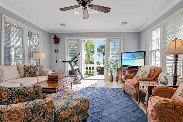 living room featuring crown molding, a wealth of natural light, and ceiling fan