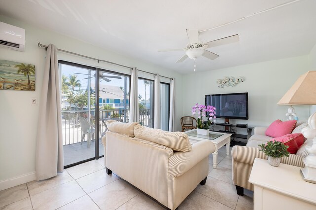 tiled living room featuring an AC wall unit and ceiling fan