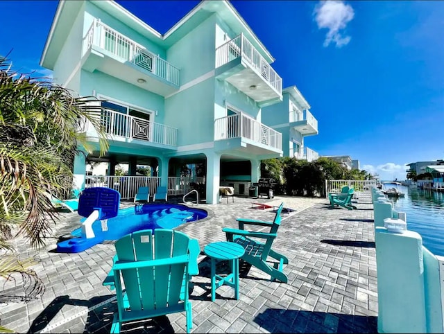 exterior space featuring a patio area and a swimming pool