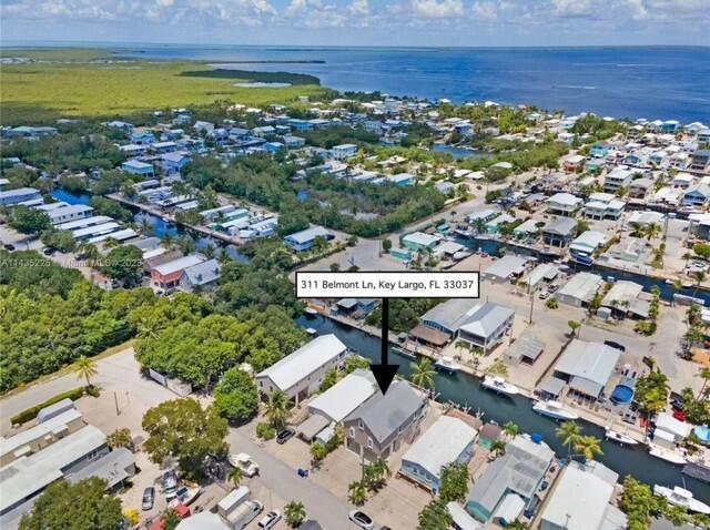 bird's eye view with a water view