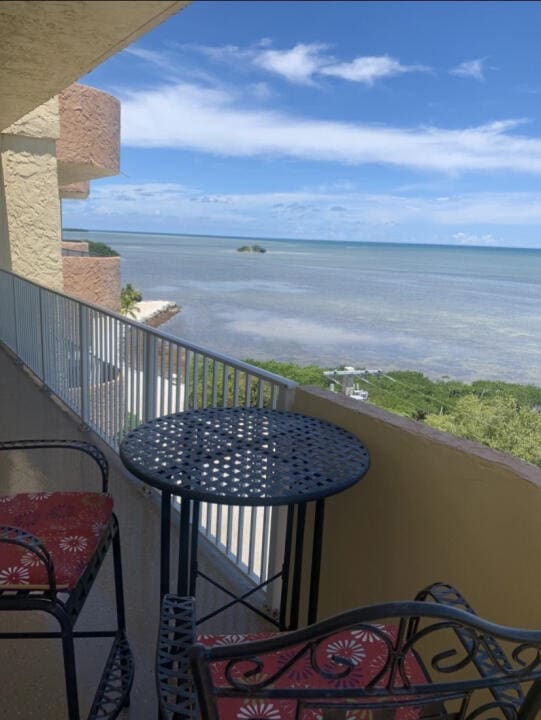 balcony featuring a water view