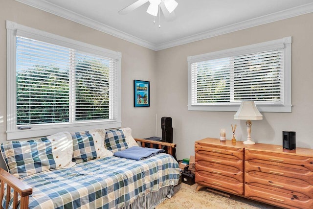 bedroom featuring ceiling fan and crown molding