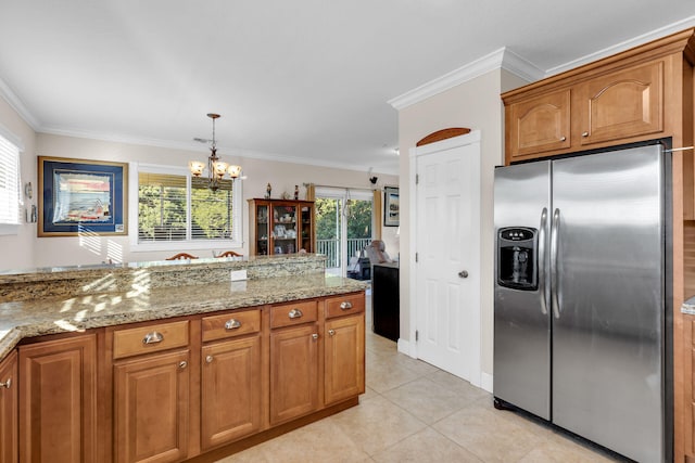 kitchen with crown molding, light tile patterned flooring, brown cabinets, and stainless steel fridge with ice dispenser