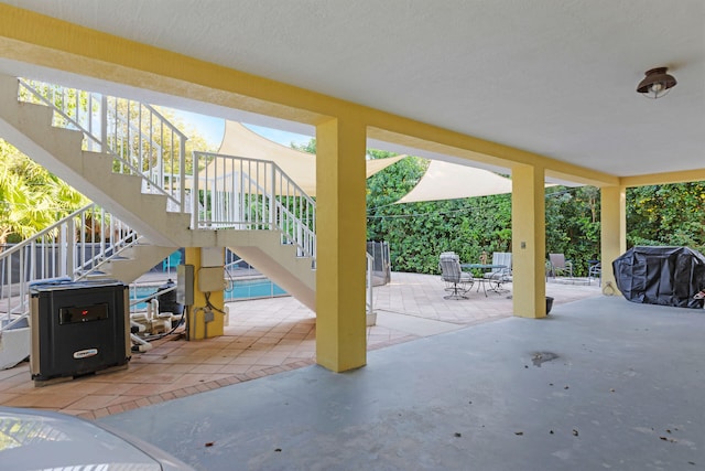 view of patio / terrace featuring stairs