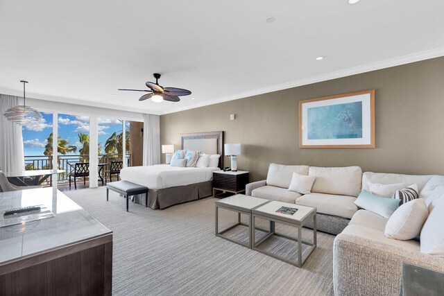 carpeted bedroom featuring access to outside, ornamental molding, and ceiling fan